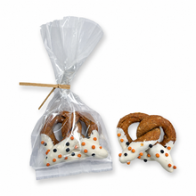 Halloween yogurt-dipped dog pretzel shown in its bag and on its own
